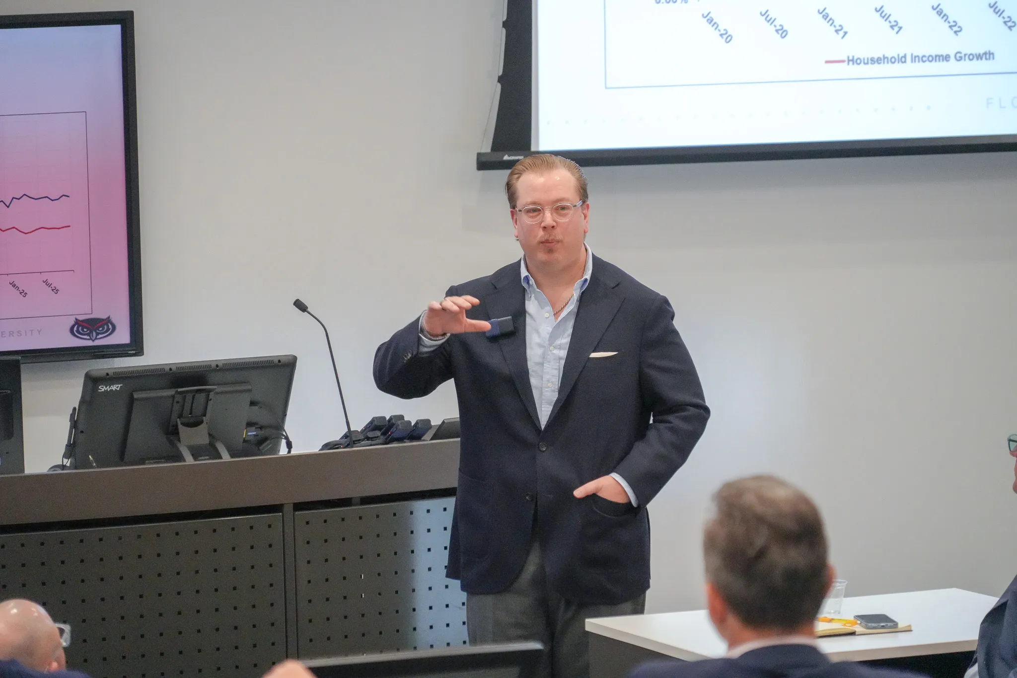 Bryan Cutsinger briefing a business audience on South Florida economic data at the FAU Research Park presentation