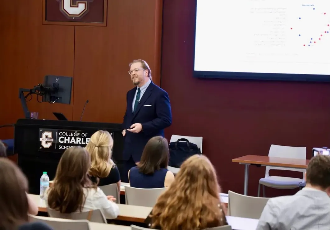 Bryan Cutsinger presenting to an audience from the podium at the College of Charleston